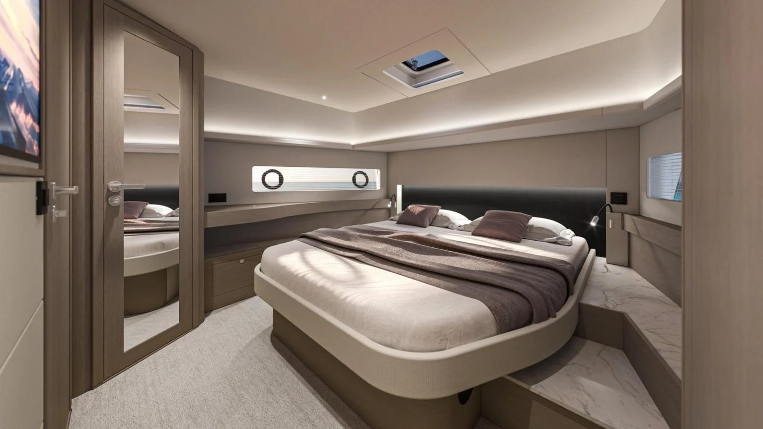 Owner's cabin of a Bénéteau Gran Turismo with skylight and hull portholes