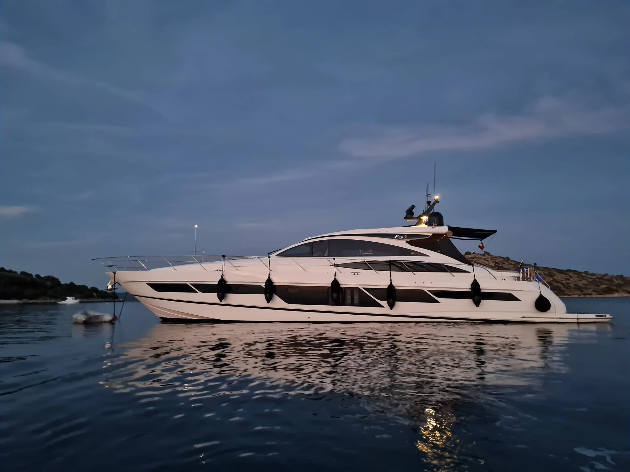 Princess V70 at anchor at dusk