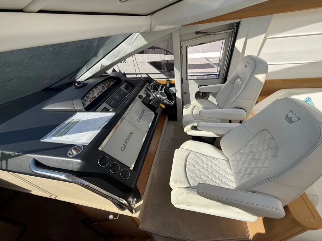 Helm with twin Garmin displays, Dockmate and Seakeeper controls