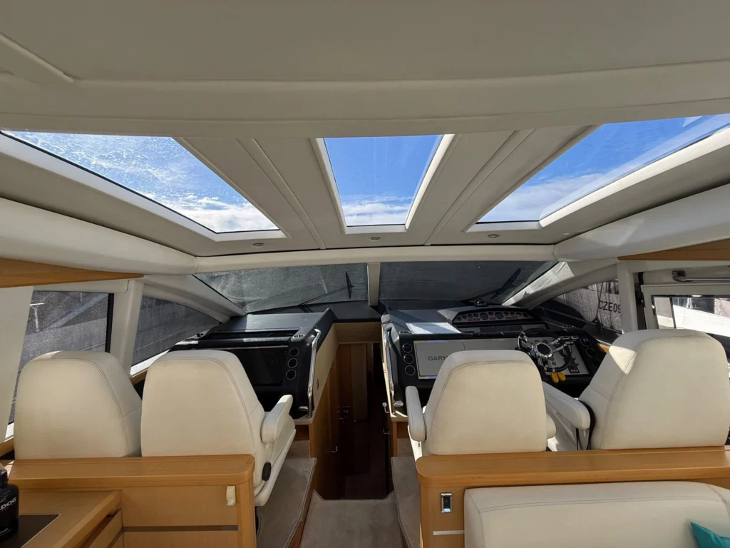 Twin helm seats beneath the electric sliding sunroof