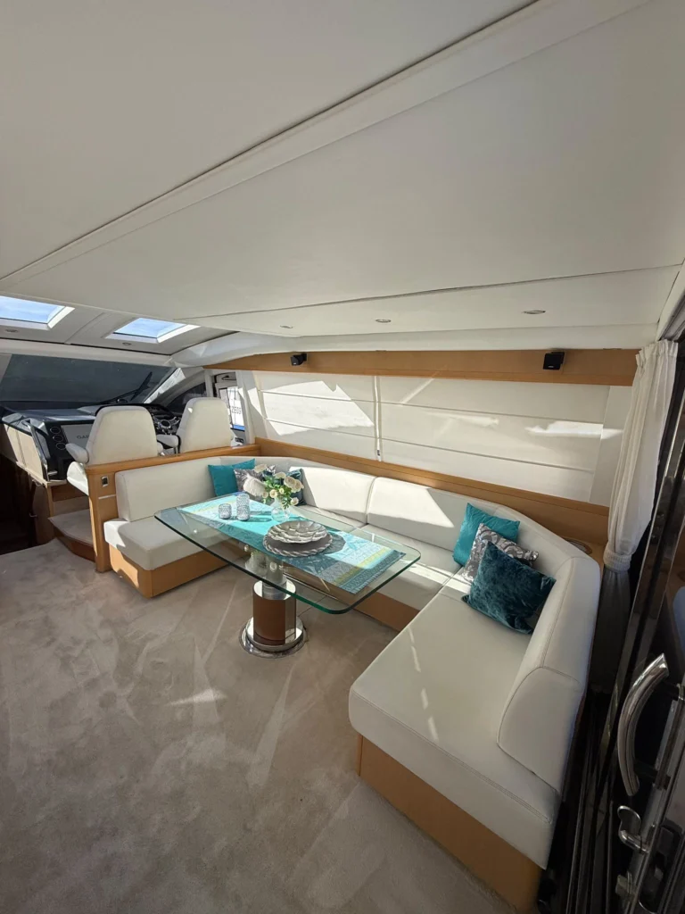 Dining area with U-shaped seating in the Princess V70 saloon